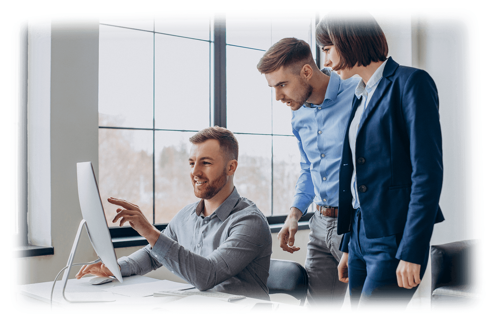 Product team collaborating around a workspace